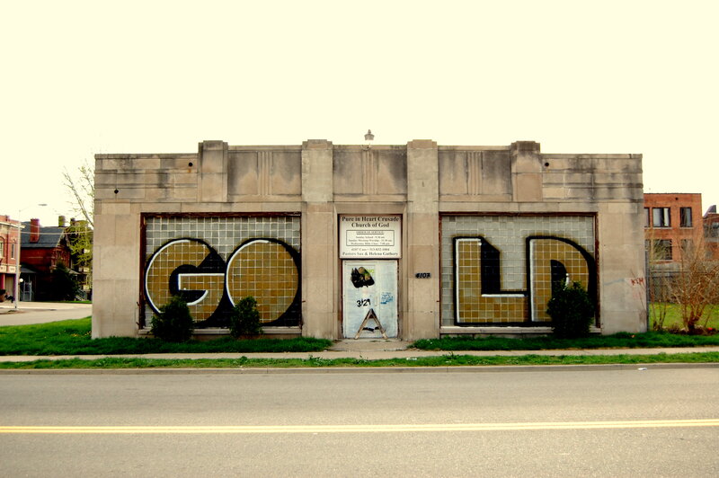 GOLD graffiti on church building