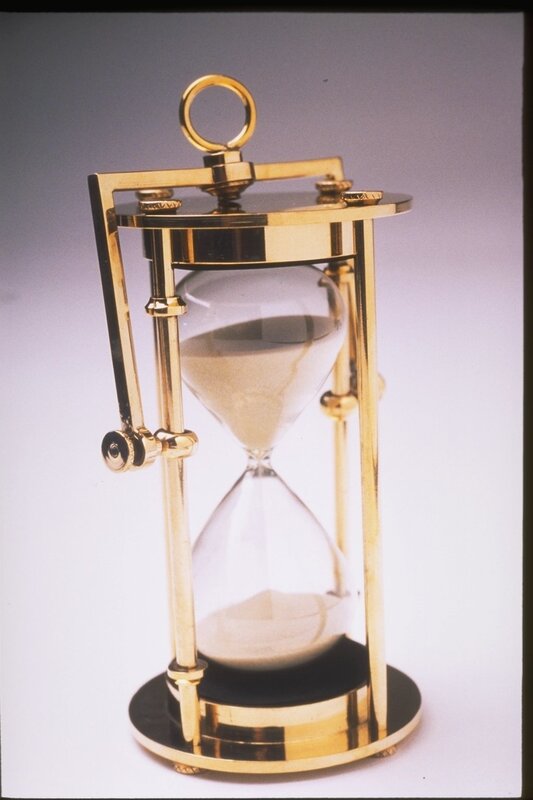gold hourglass in frame