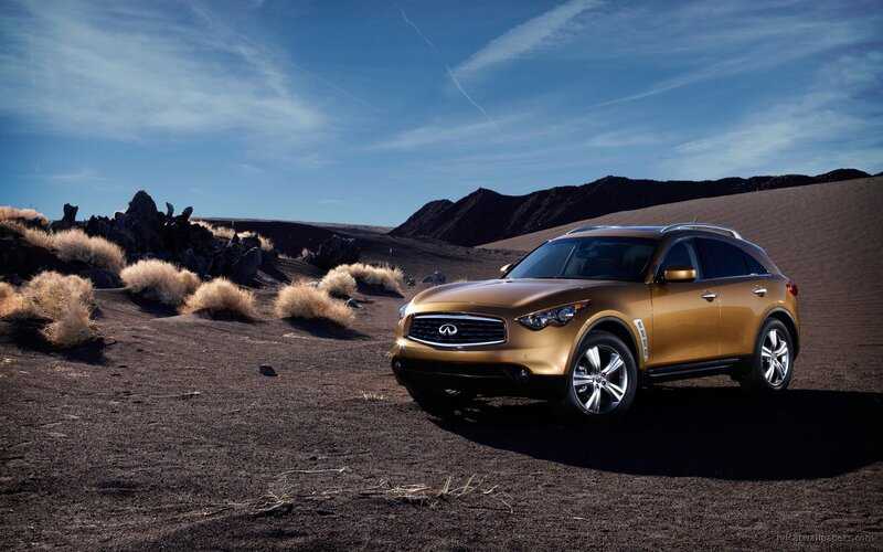 Gold Infiniti FX in desert