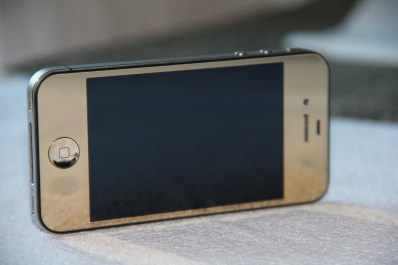 gold iPhone on fabric