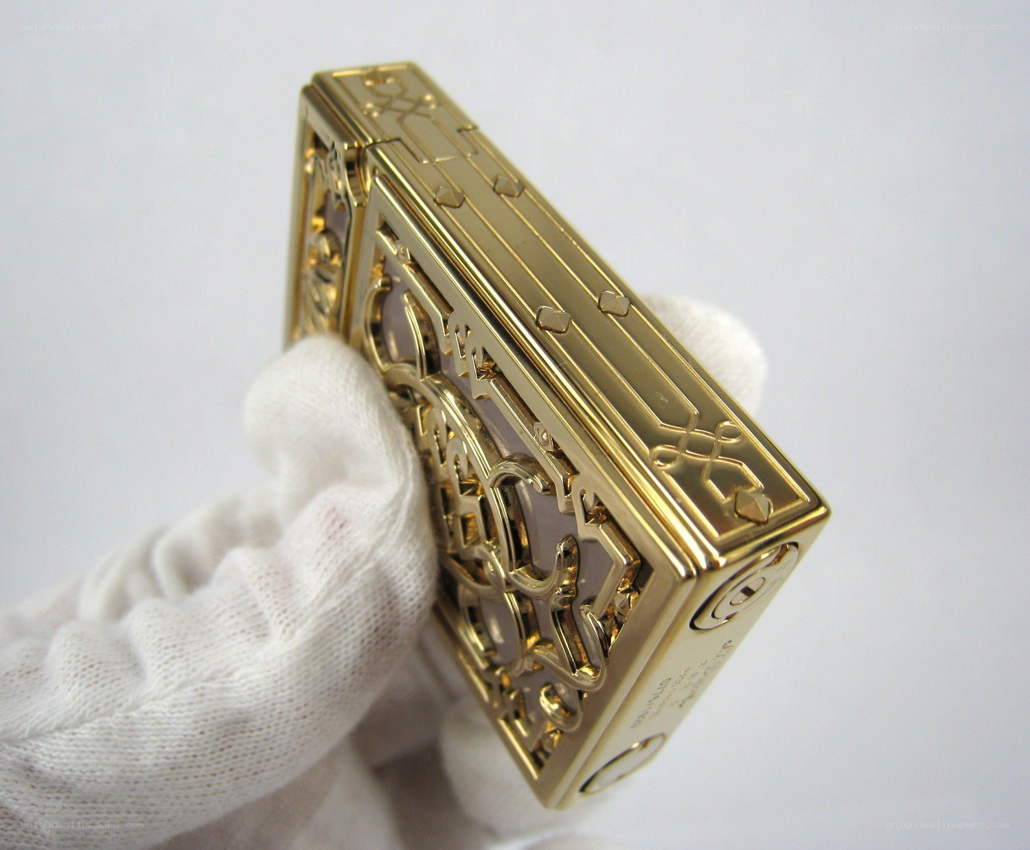 gold lighter with intricate design
