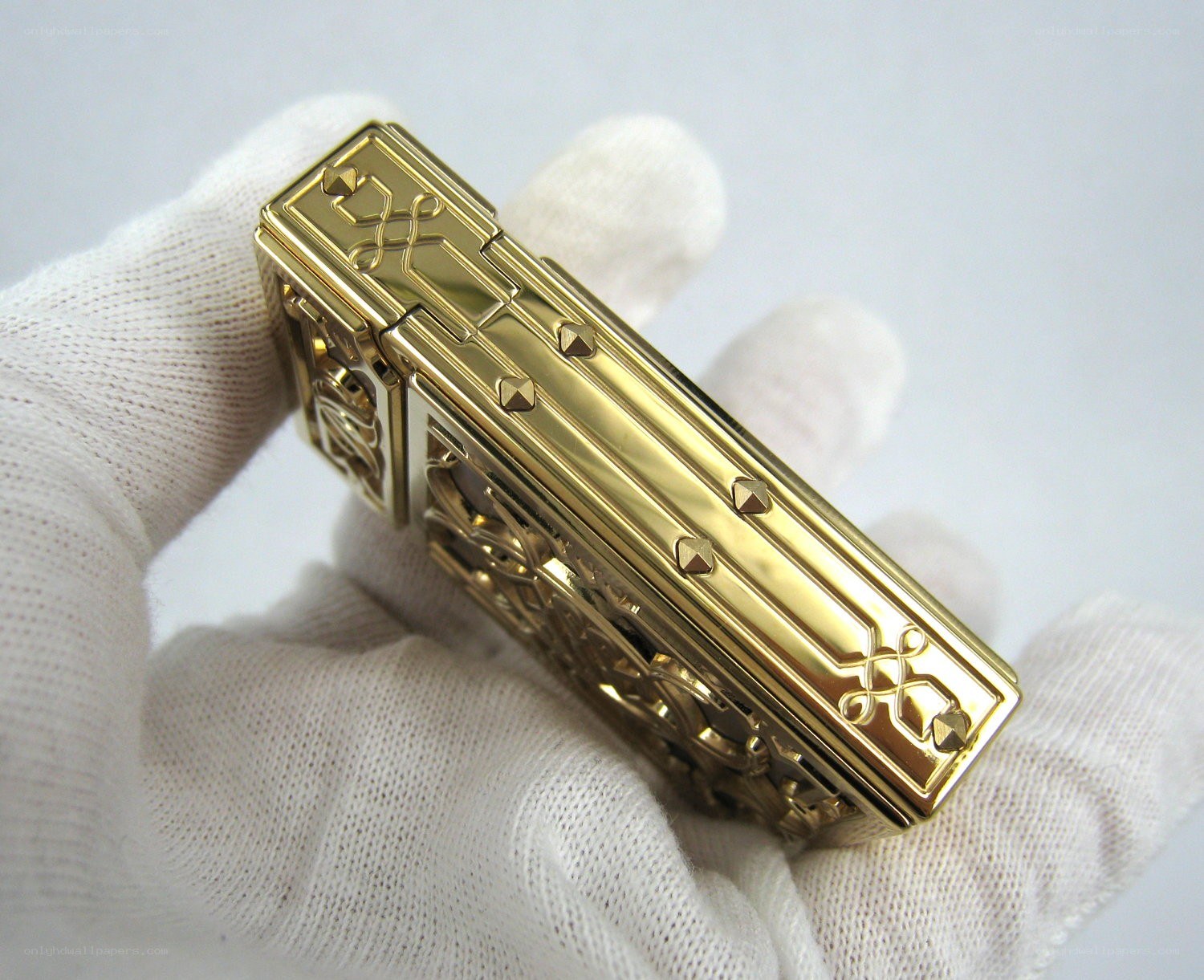 gold lighter with intricate design