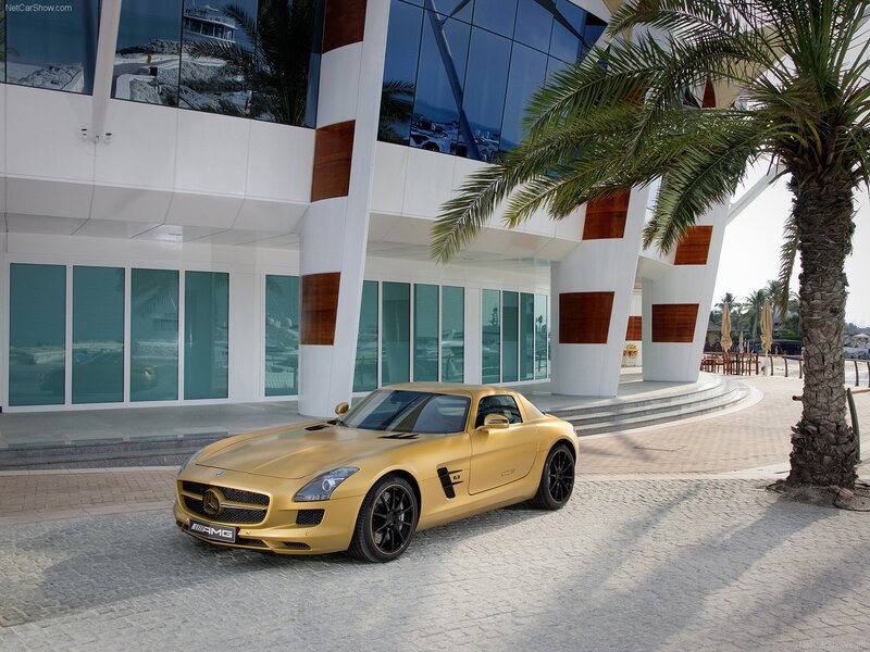 Gold Mercedes-AMG SLS parked outside