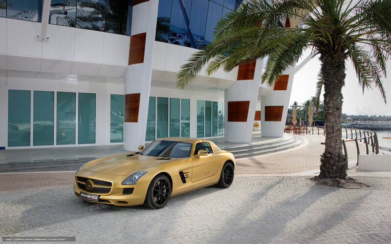 Gold Mercedes-AMG SLS parked outside