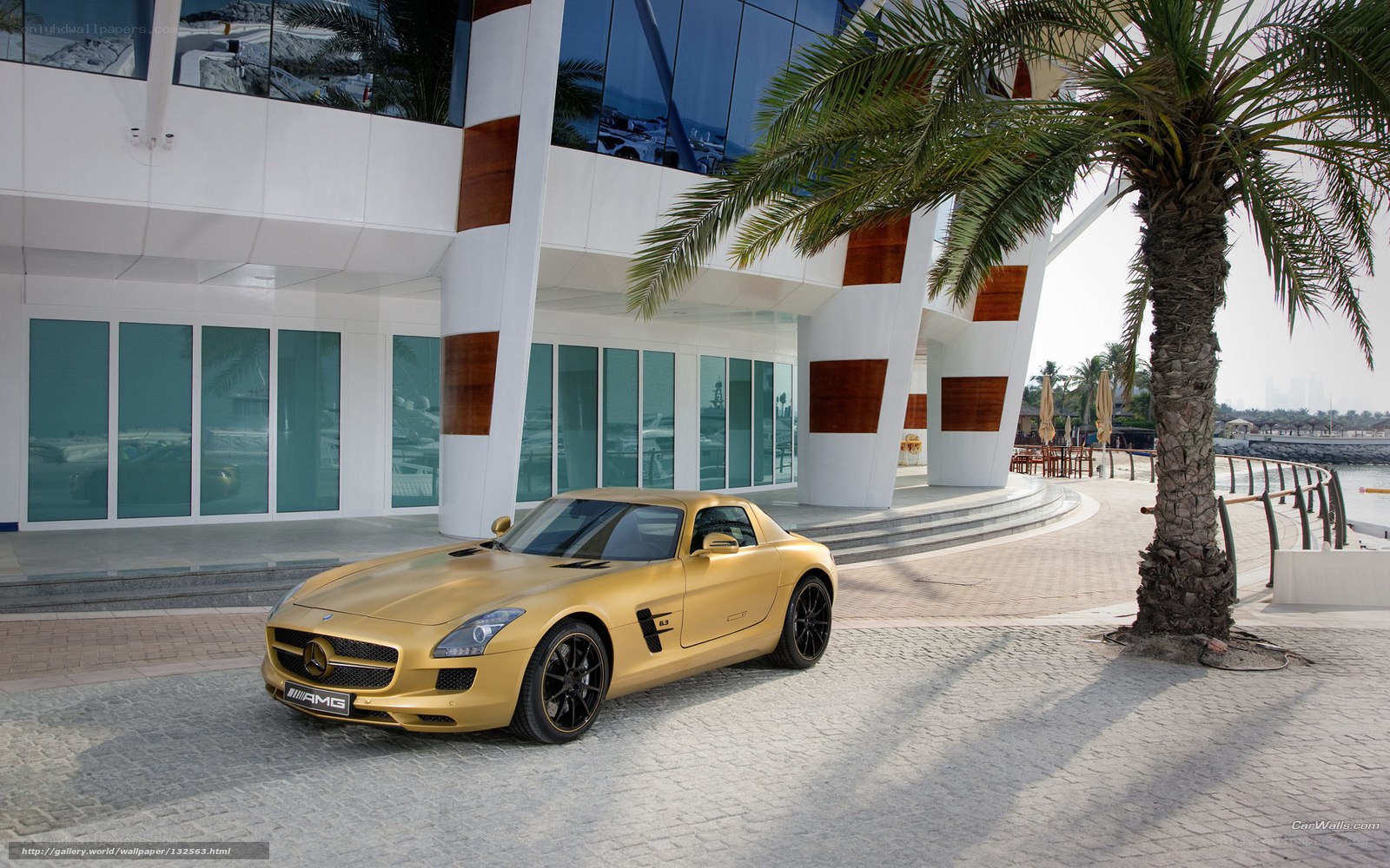 Gold Mercedes-AMG SLS parked outside