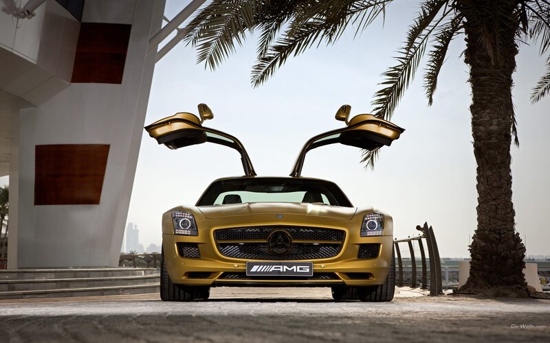 Gold Mercedes-AMG SLS with doors open