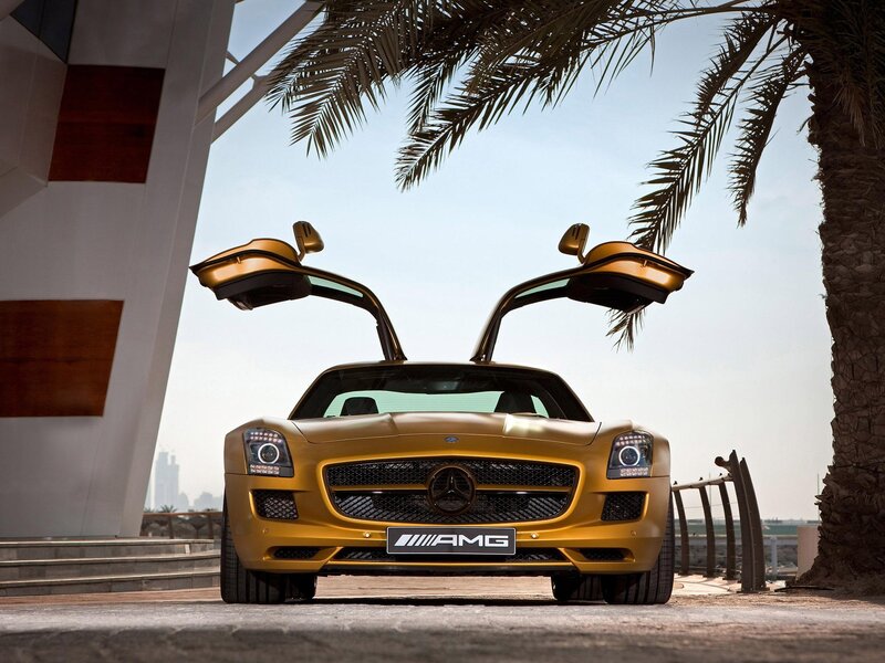 Gold Mercedes-AMG SLS with doors open