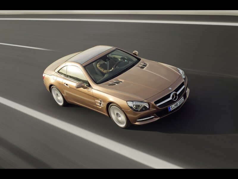 Gold Mercedes-Benz SL driving