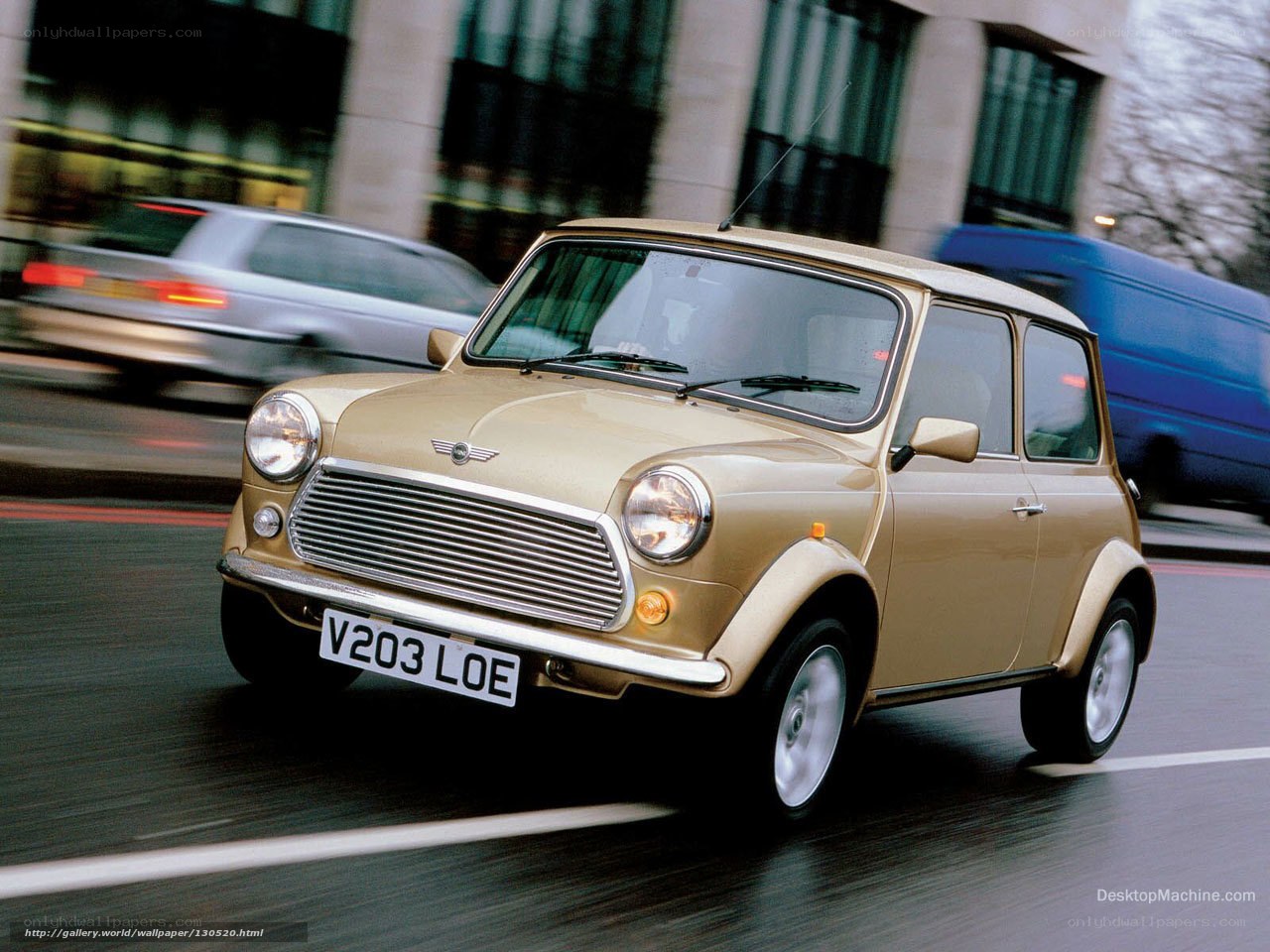gold mini cooper in motion