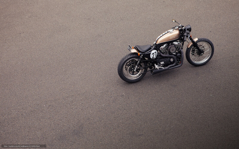 gold motorcycle on asphalt