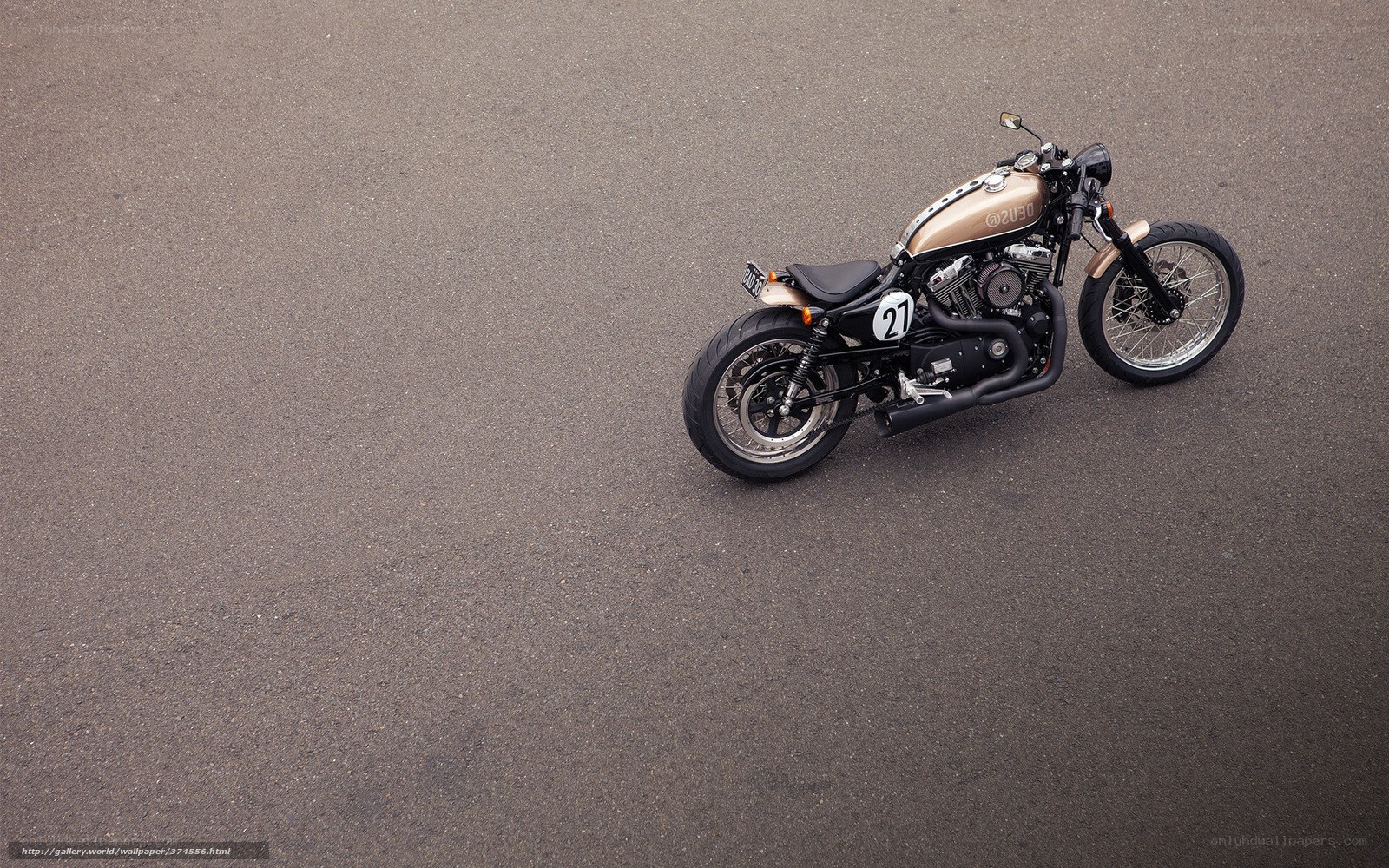 gold motorcycle on asphalt