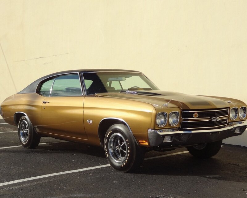 Gold muscle car parked