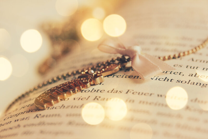 Gold Necklace on Book — Warm