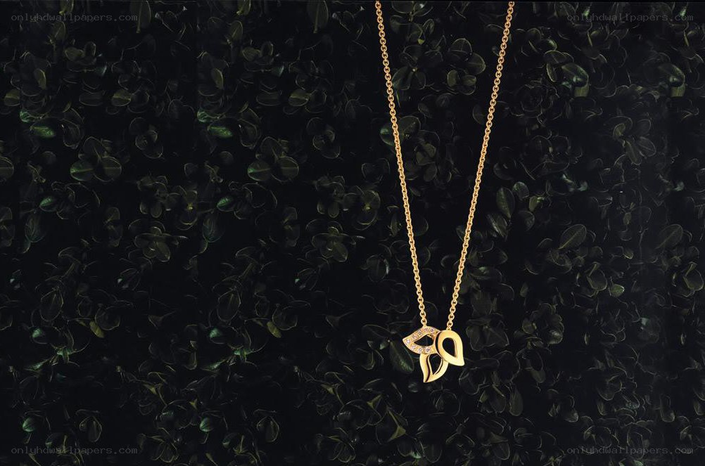 gold necklace with leaf pendant