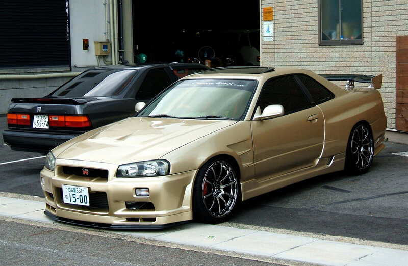 Gold Nissan GT-R parked outside