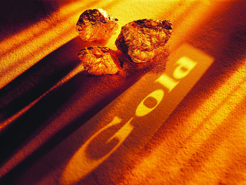 gold nuggets on textured surface