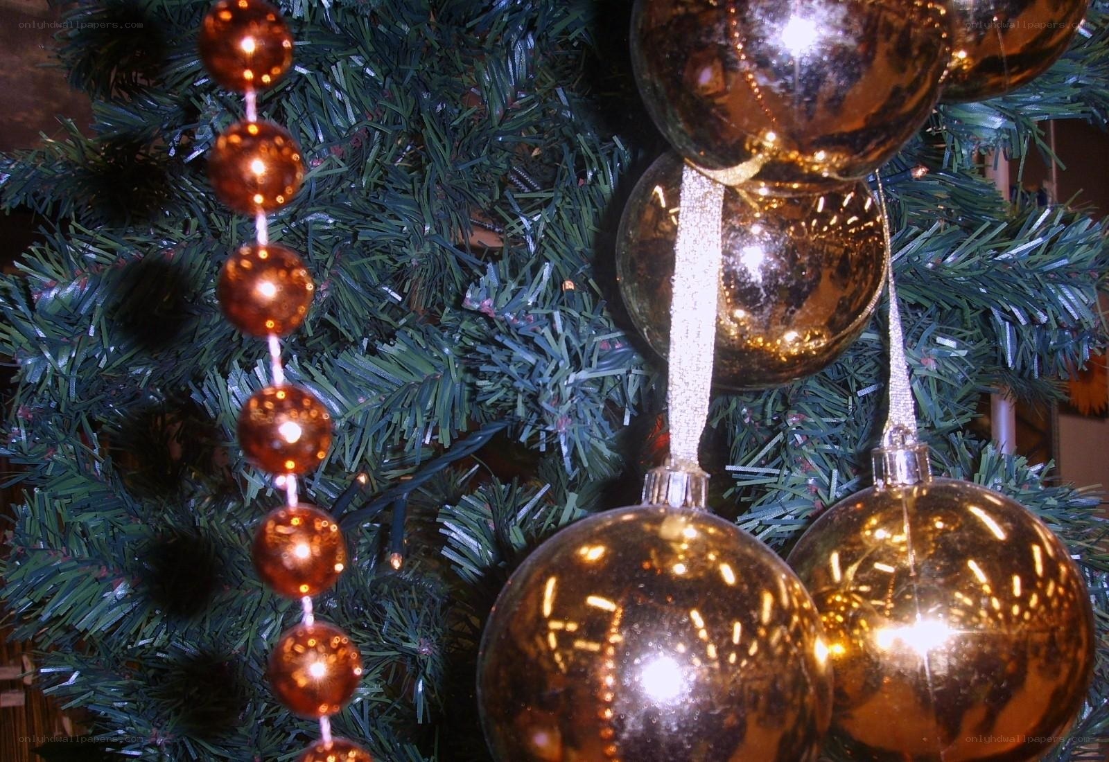 Gold ornaments on a Christmas tree