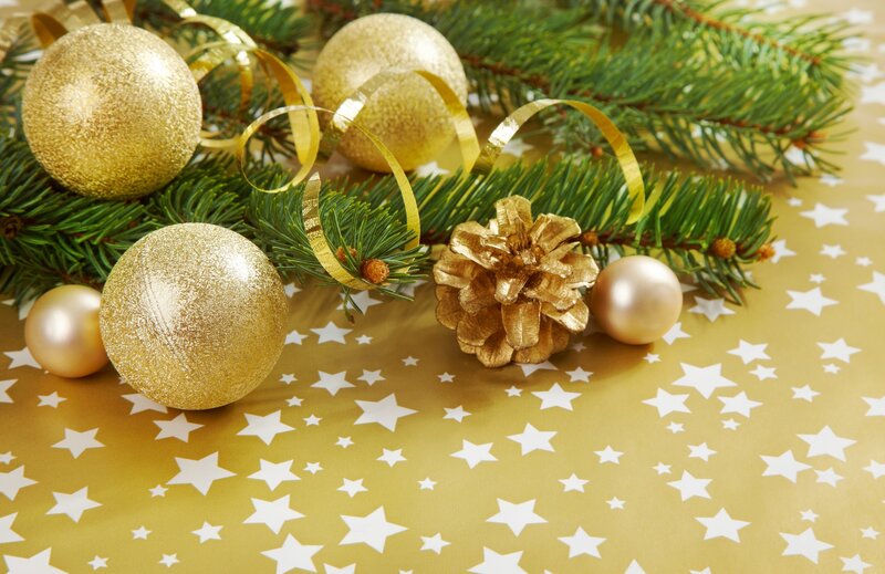 Gold Ornaments on Pine Branches — Festive