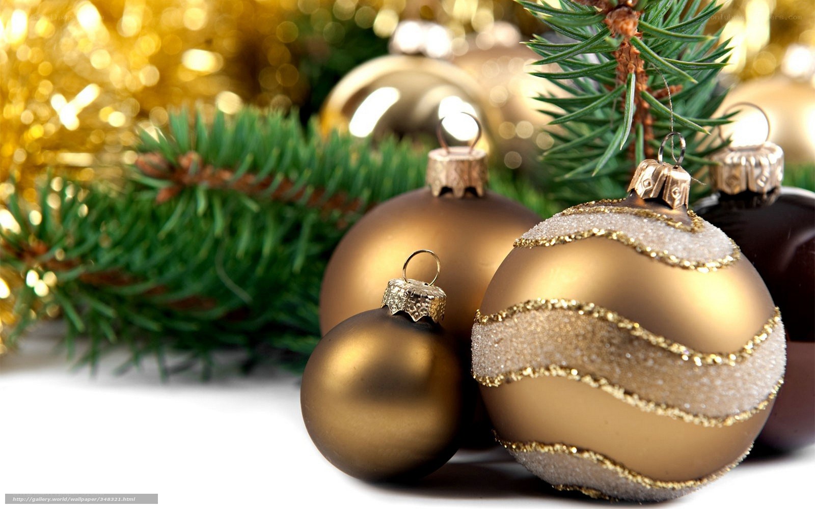 gold ornaments on pine branches