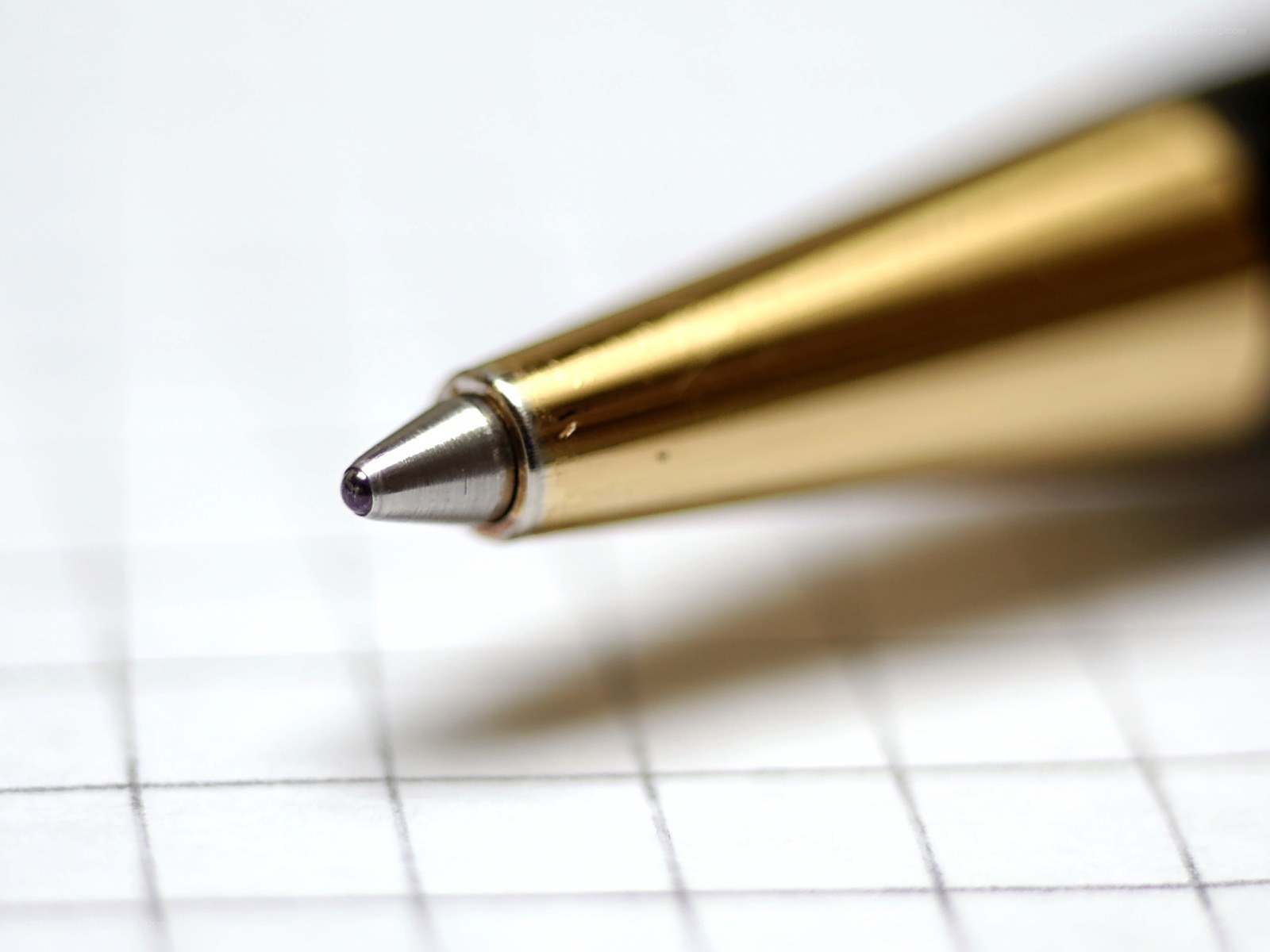 gold pen on graph paper