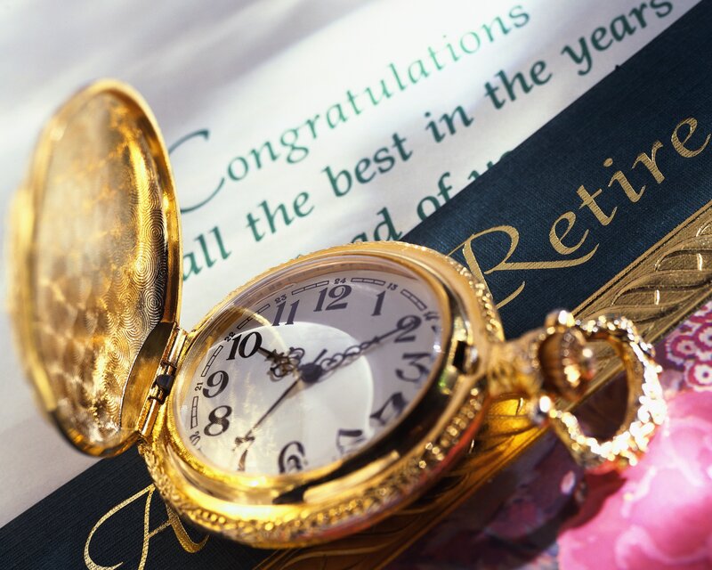 Gold pocket watch on retirement card