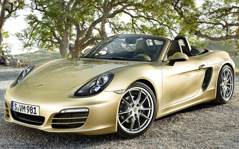 Gold Porsche Boxster parked