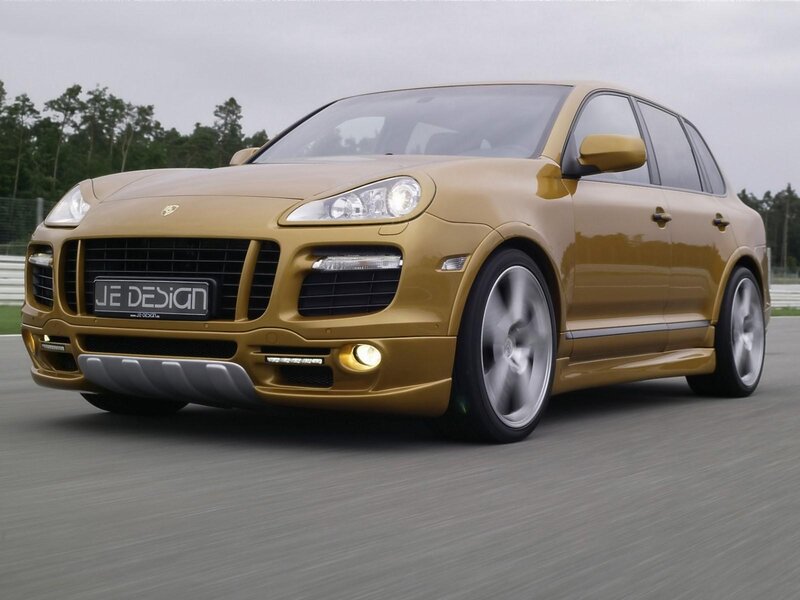 Gold Porsche Cayenne on track