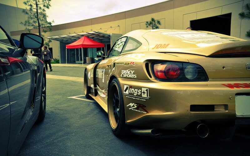 Gold race car at outdoor event