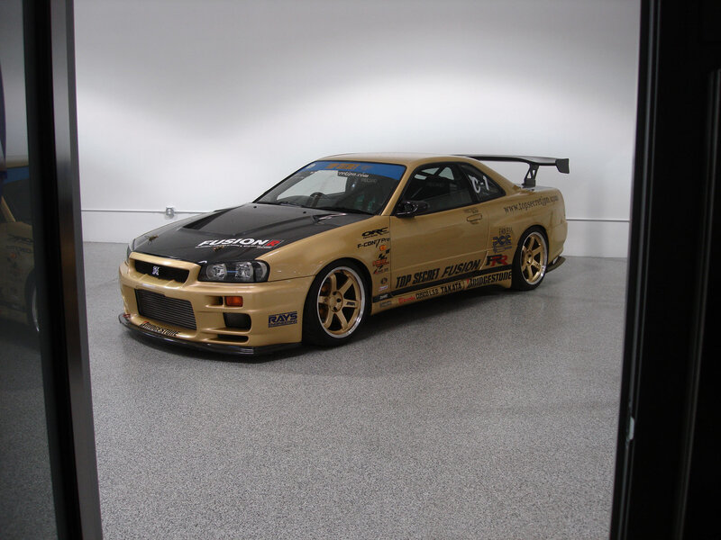 gold race car in garage