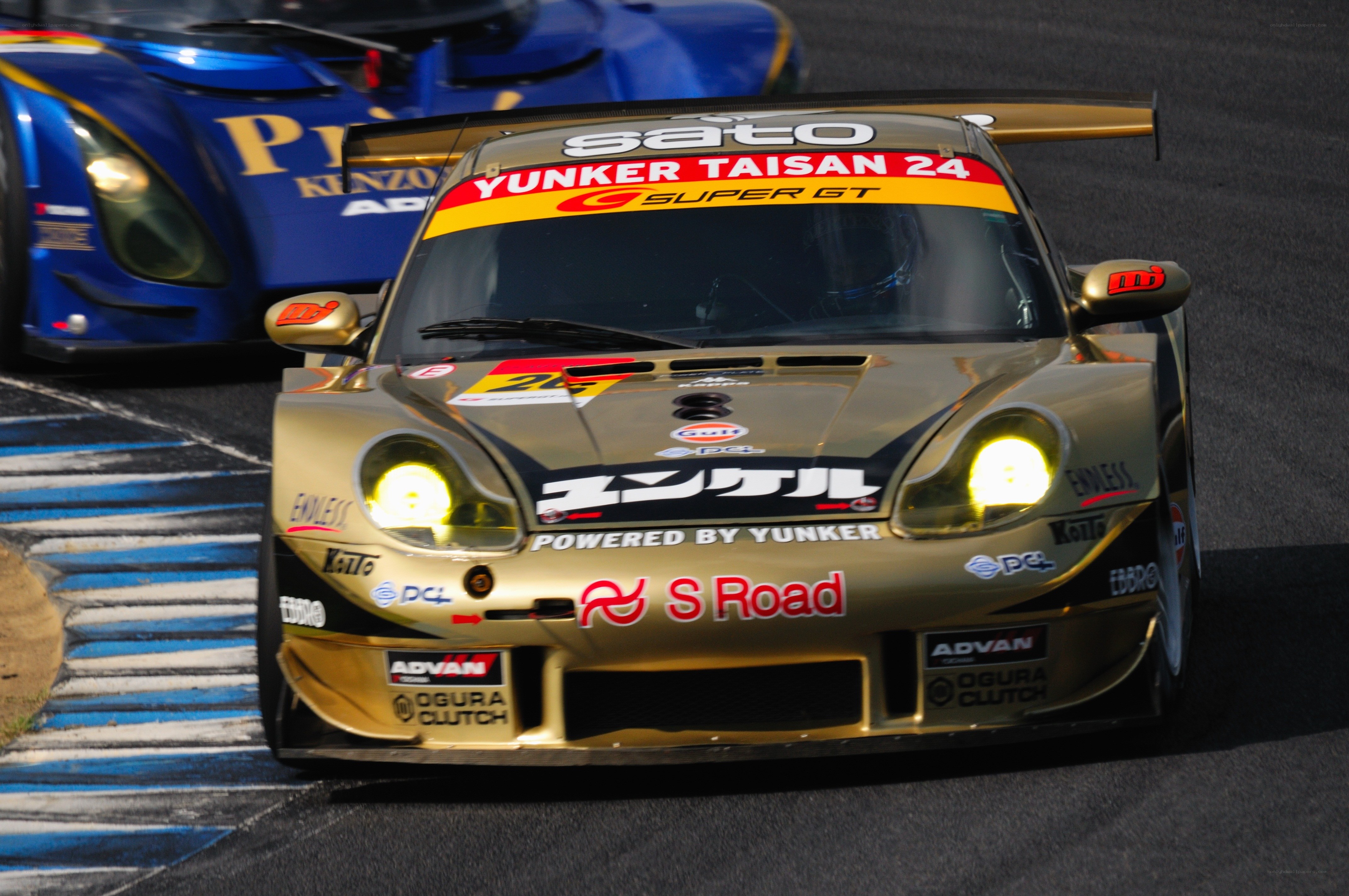 Gold race car on track