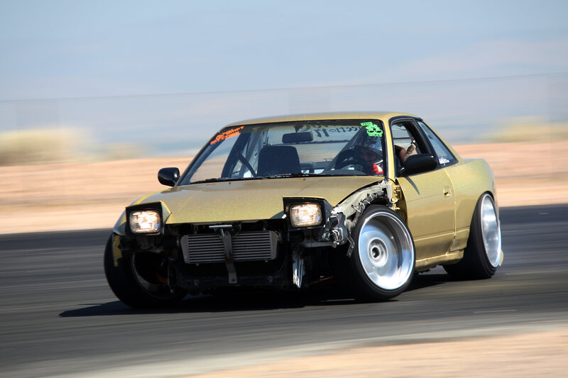 gold race car on track