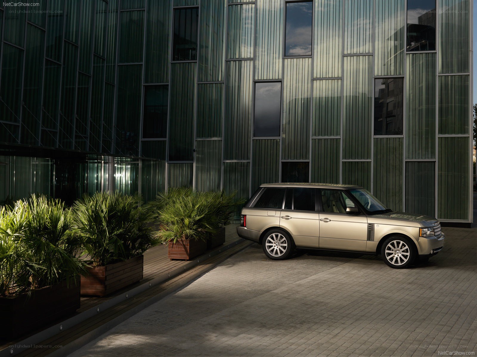 Gold Range Rover in modern setting