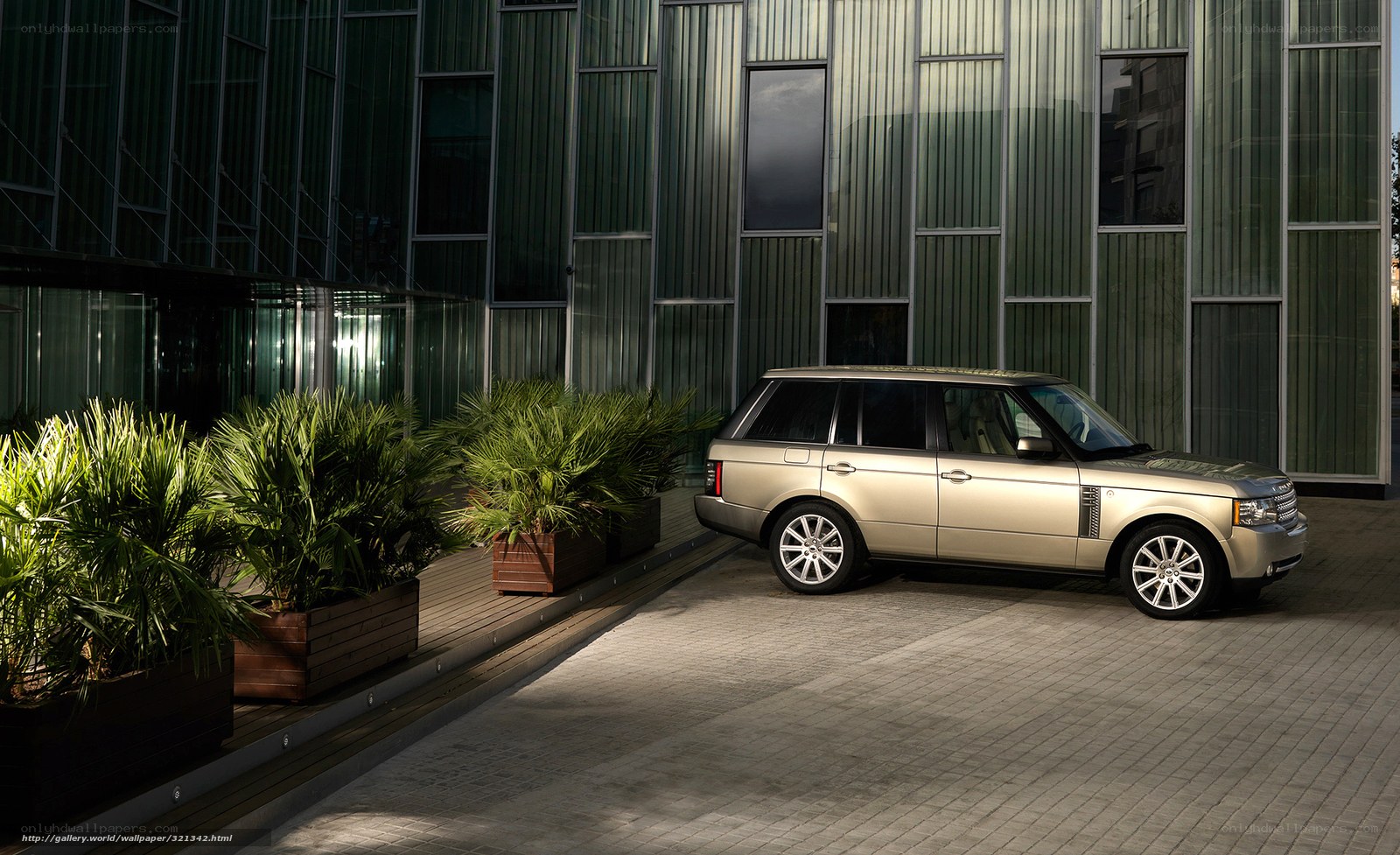 Gold Range Rover in modern setting