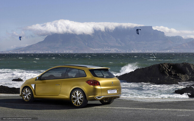 Gold Renault Clio on coastal road