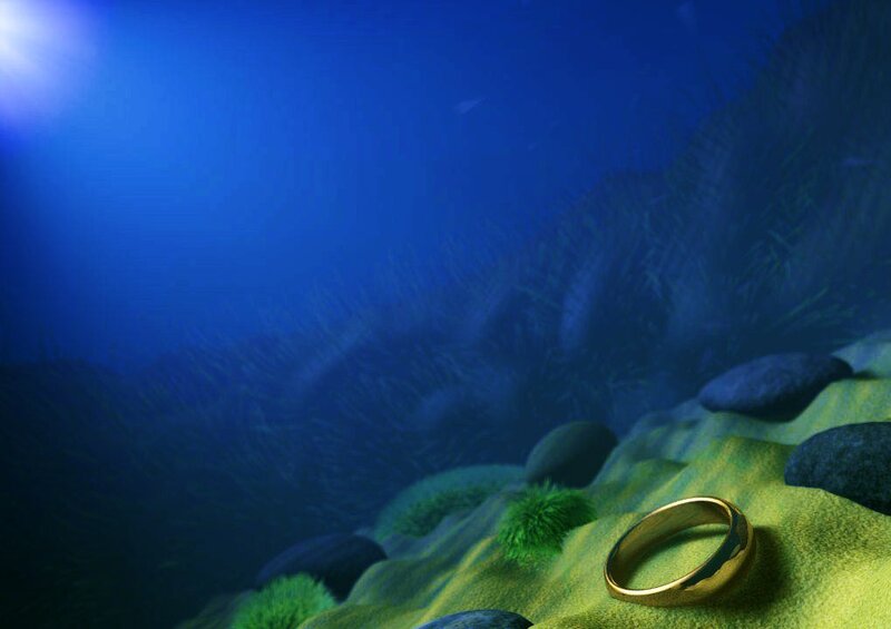 gold ring on ocean floor
