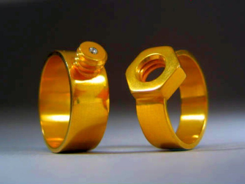 gold rings shaped like nuts and bolts