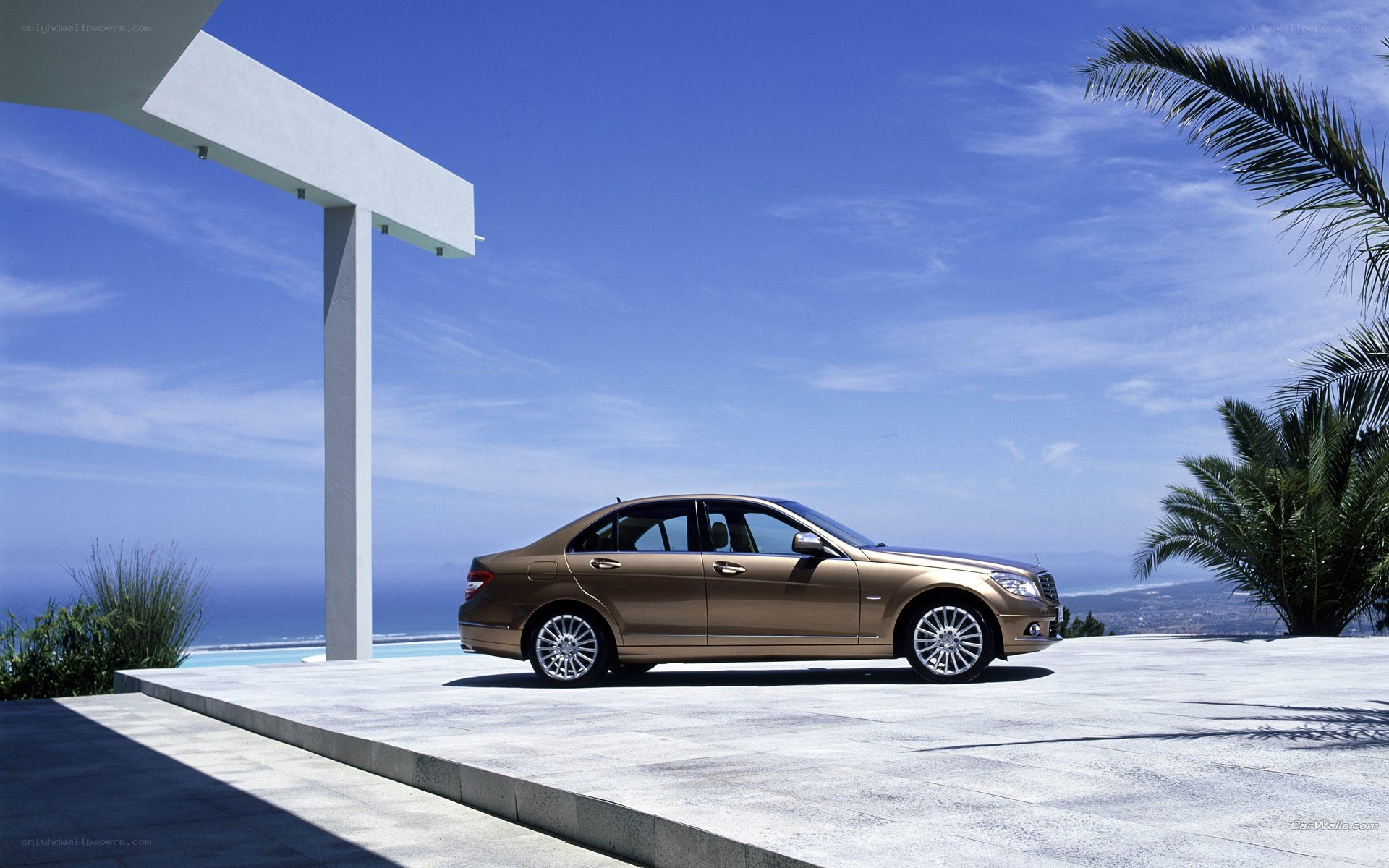 Gold sedan by the pool