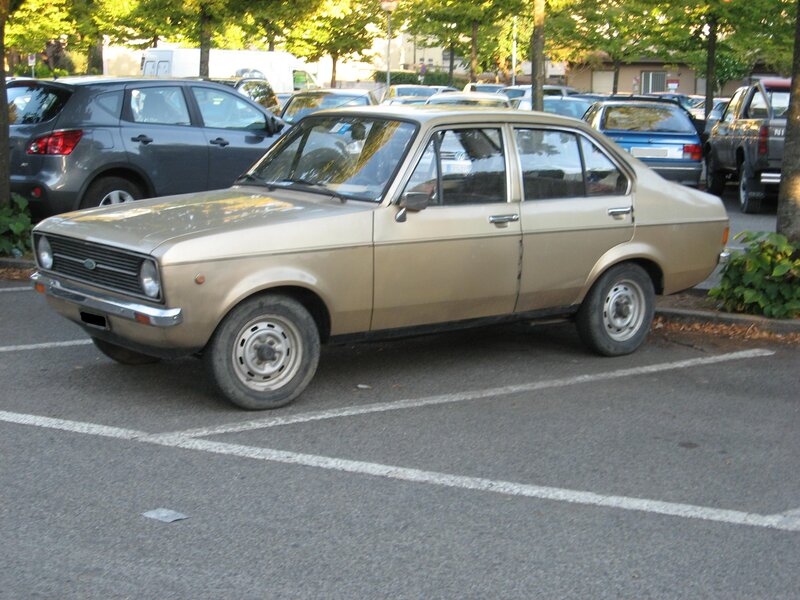 Gold sedan in parking lot