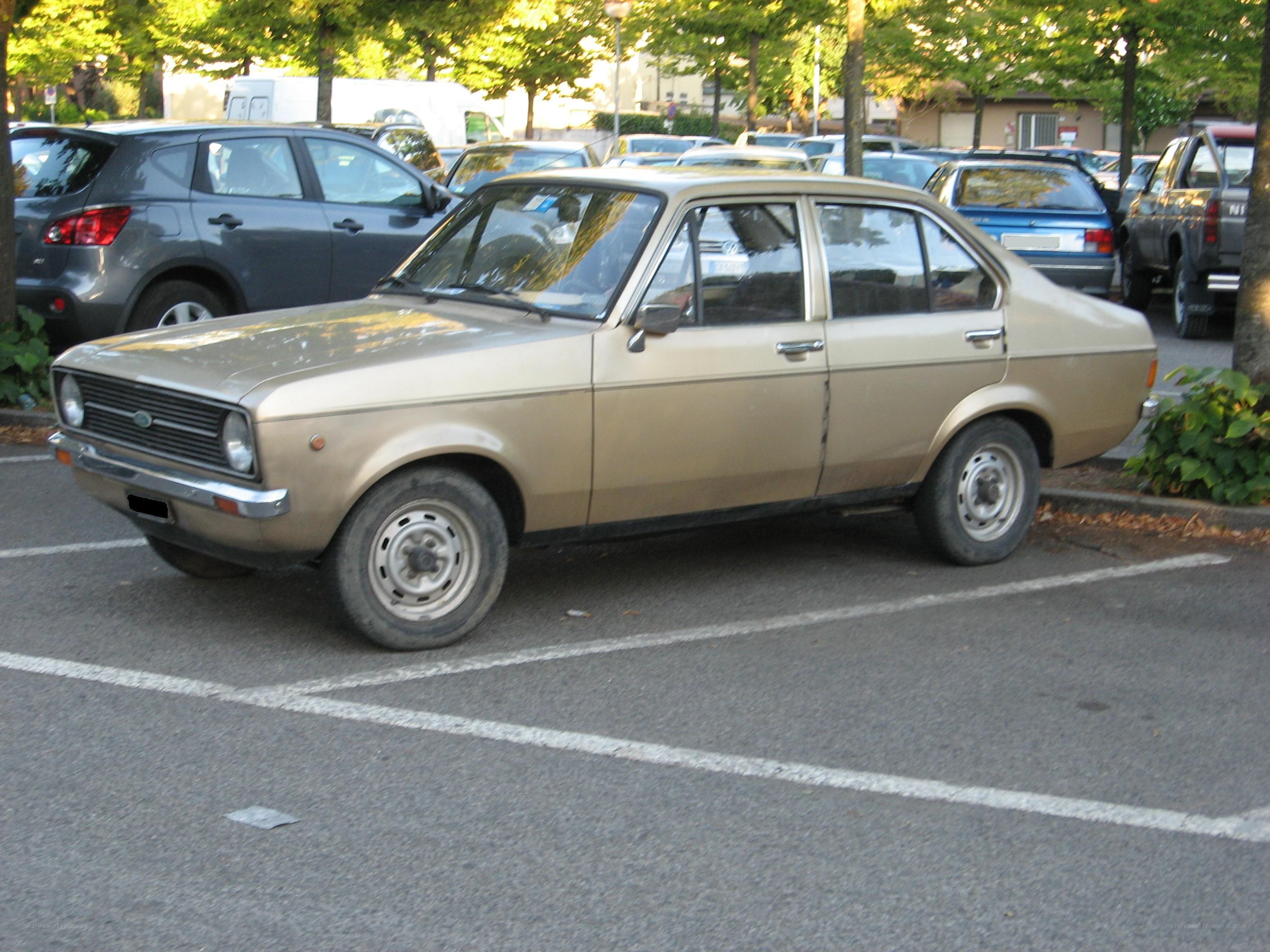Gold sedan in parking lot
