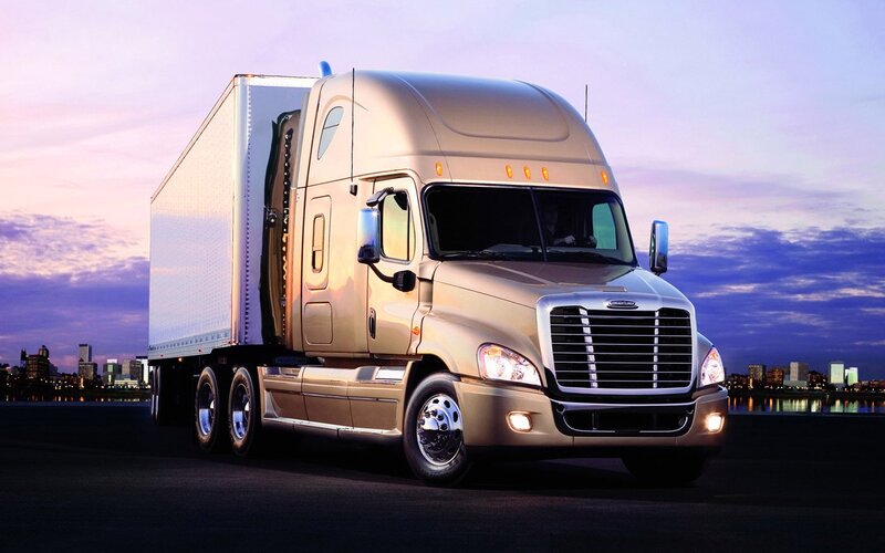 gold semi-truck at dusk