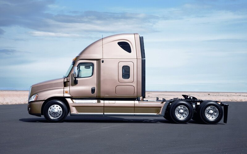 gold semi-truck on asphalt