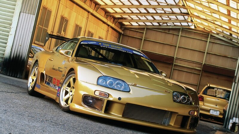Gold Sports Car — Dramatic, Photograph, Garage