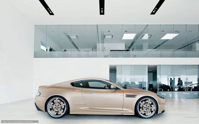 gold sports car in showroom