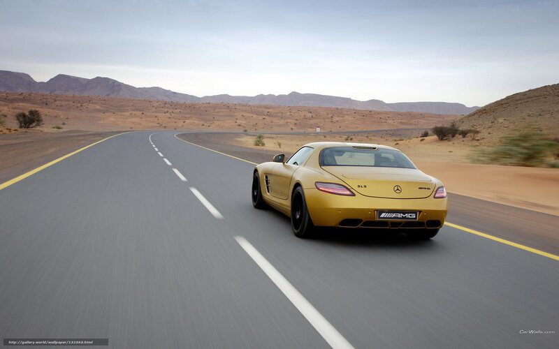 Gold sports car on desert road