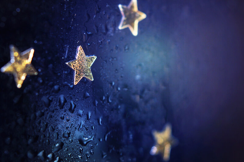 Gold Stars on Wet Surface