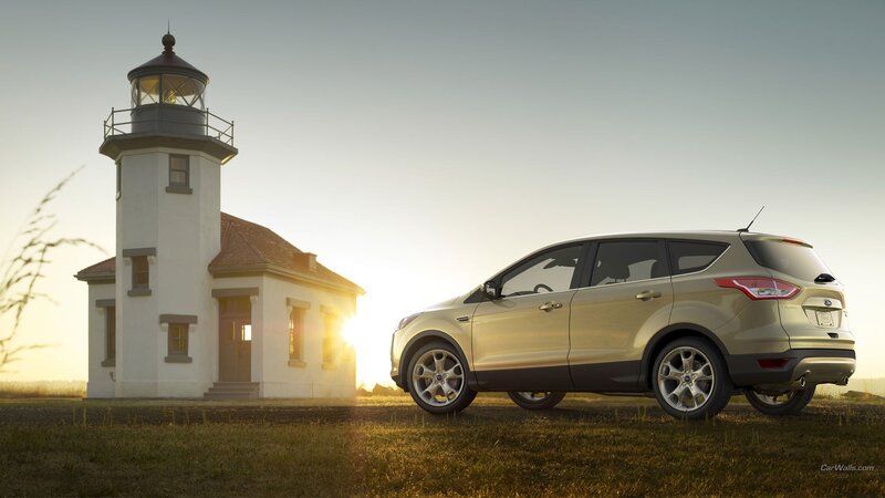Gold Suv Near Lighthouse