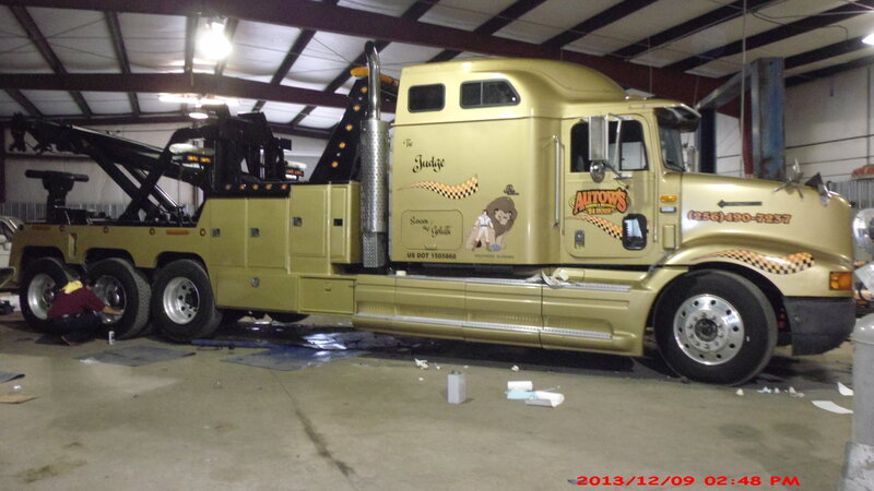 Gold Tow Truck in Garage