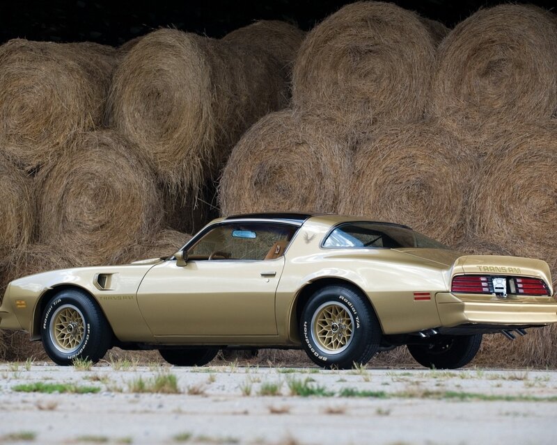 Gold Trans Am with hay bales