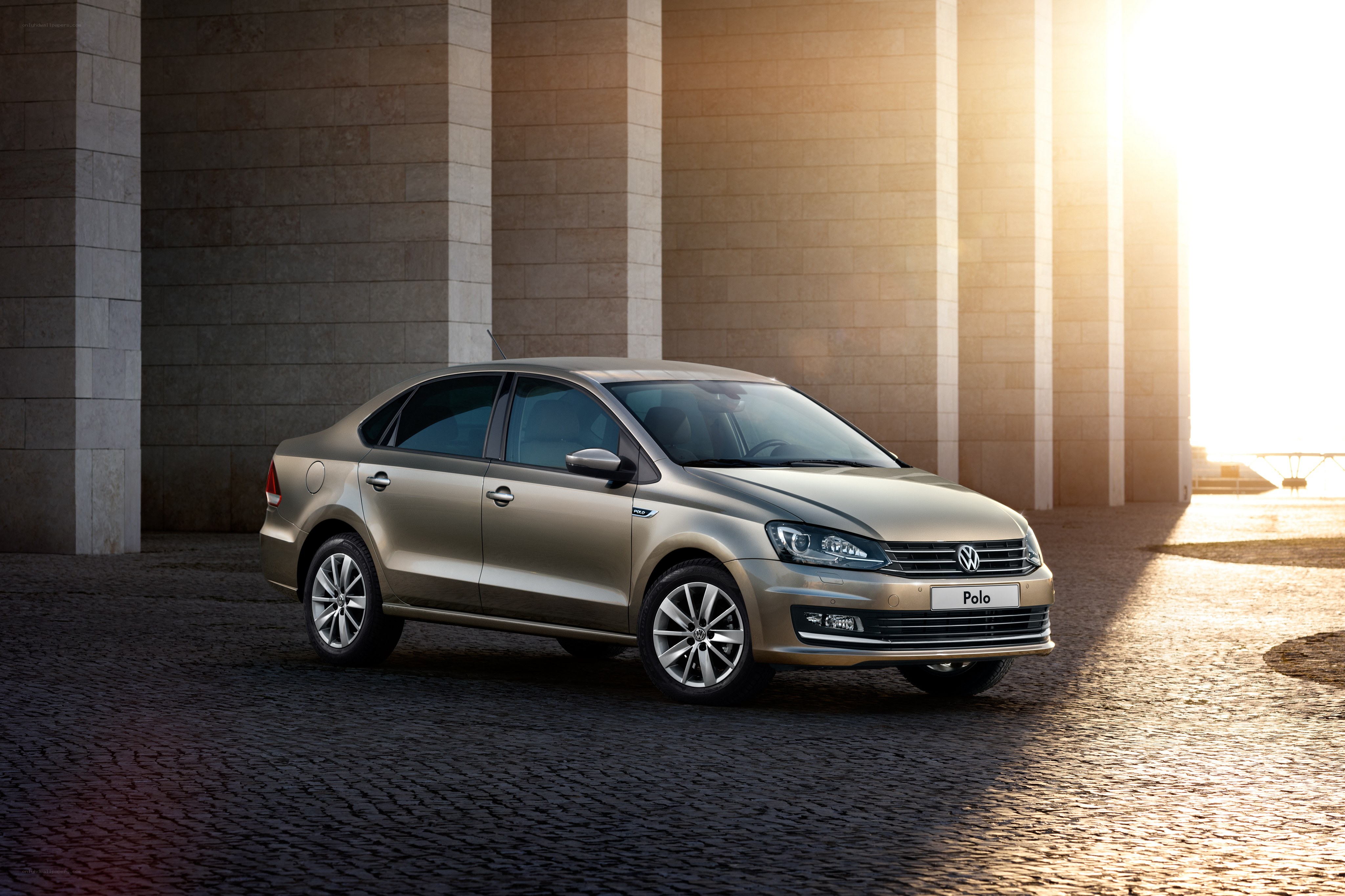 Gold Volkswagen Polo sedan