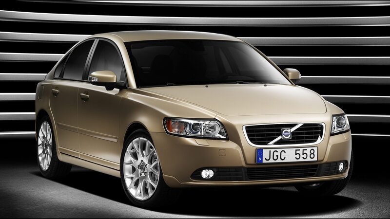 Gold Volvo Sedan — Dramatic